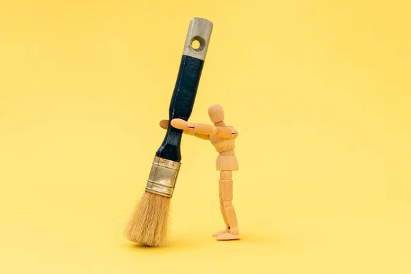 Wooden Painter Holding Big Paintbrush Yellow Background — Stock Photo, Image