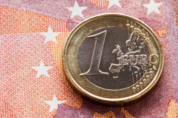 Euro coin on ten Euros banknote — Stock Photo, Image