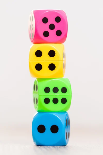 Colorful dice isolated on blurry background — Stock Photo, Image