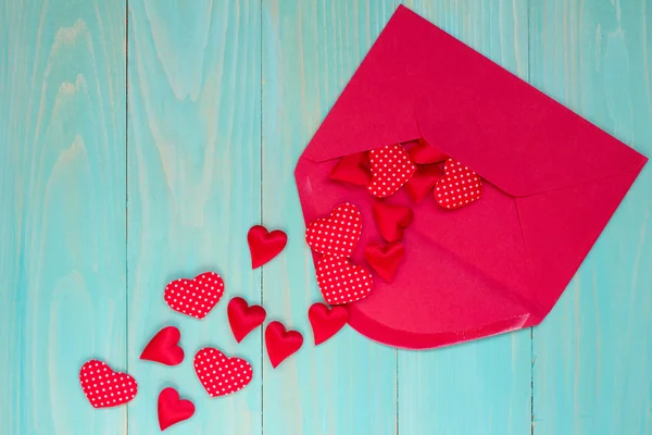 Envelope with  hearts on blue background — Stock Photo, Image