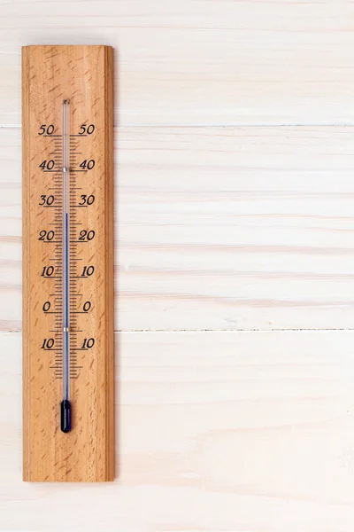 Thermometer on wooden background — Stock Photo, Image