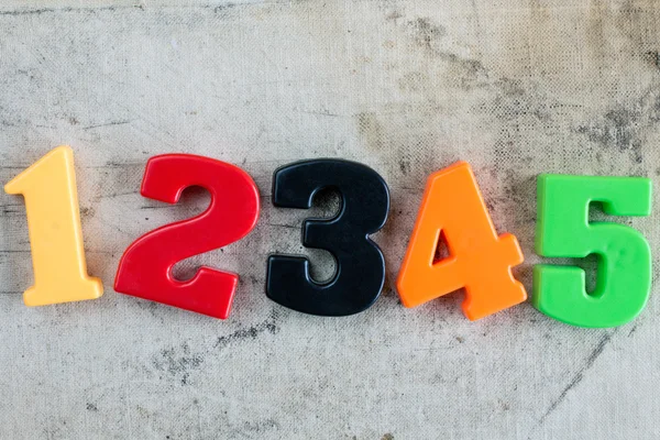 Χρωματιστά αριθμούς σε φόντο του καμβά — Φωτογραφία Αρχείου