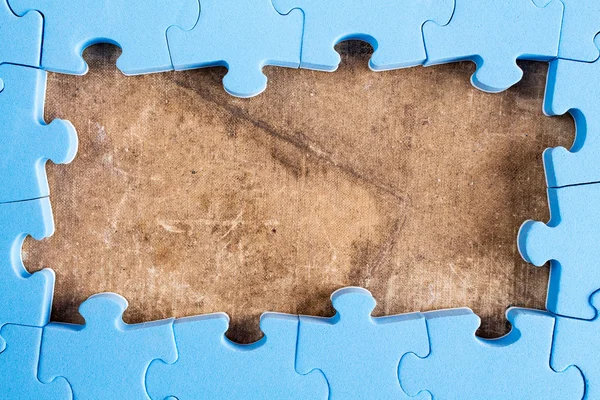 Het frame van blauwe puzzel — Stockfoto