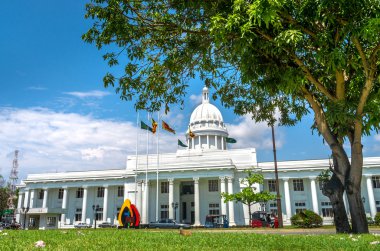 COLOMBO, SRI LANKA - FEBRUARY 27,2015. Colombo city town hall building, the headquarters of Colombo and Viharamahadevi Park, the oldest and largest park In The Heart Of The City Of Colombo clipart
