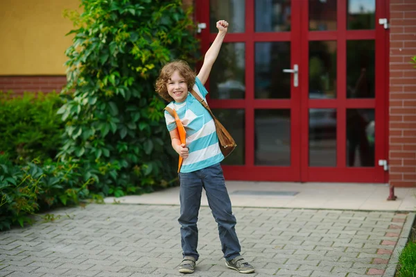 The schoolboy rejoices to the beginning of summer vacation. — Stock Photo, Image