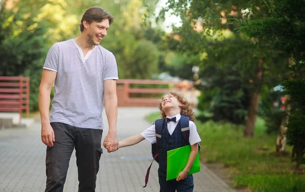 Dad escorted to school by his son. — Stock Photo, Image