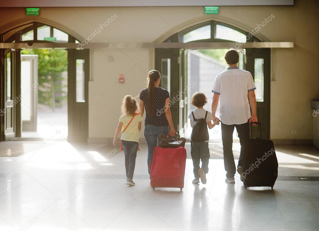 Young family in the waiting room at the station.