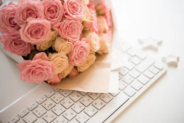 roses on white computer keyboard