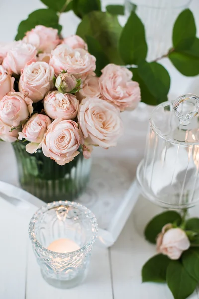 Vintage wedding table decorations with roses, candles, cutlery a — Stock Photo, Image