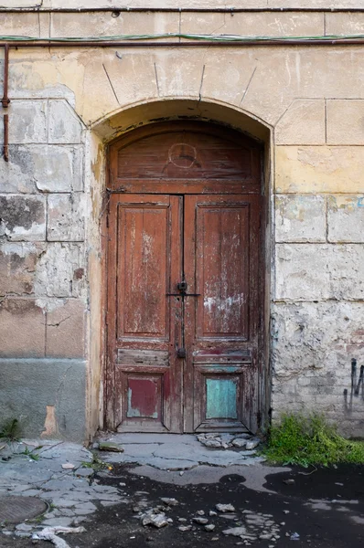 Old brown painted wooden door