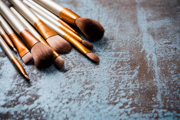 makeup brushes collection, new make-up tools set on painted back