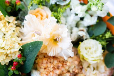 Beautiful floral background, assorted white and beige flowers, bouquer of roses and hydrangeas