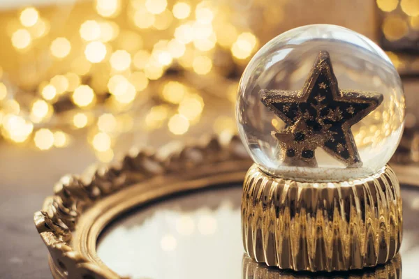 Holiday star in glass ball, Christmas decorations — Stock Photo, Image