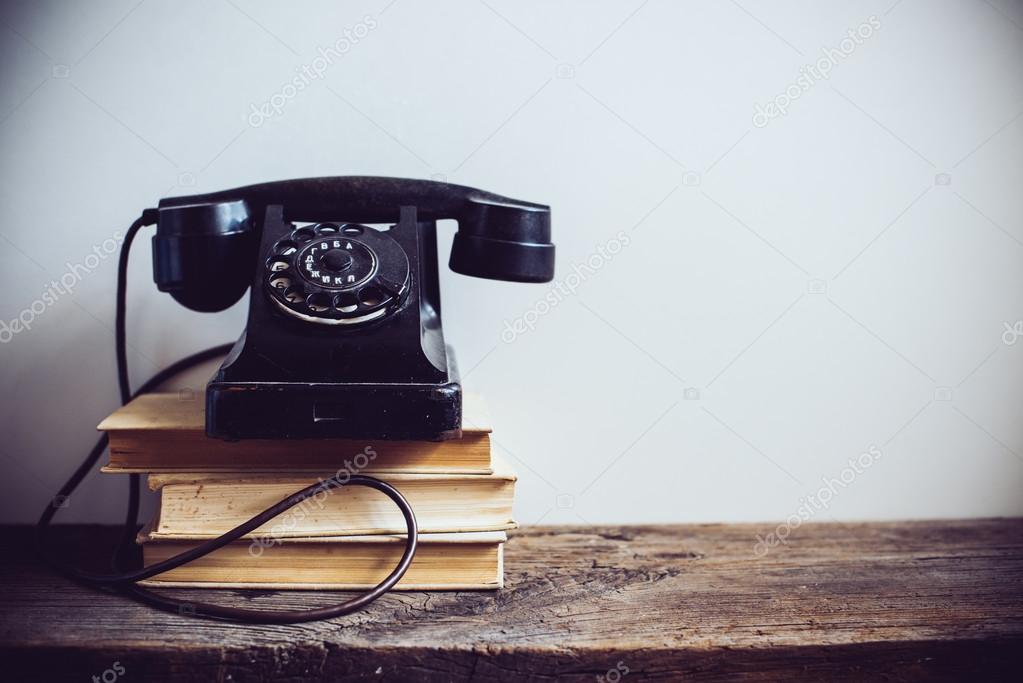 retro telephone an rustic wood wall