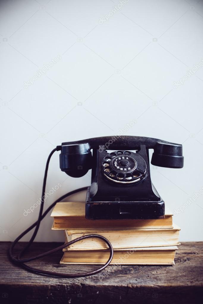 retro telephone an rustic wood wall