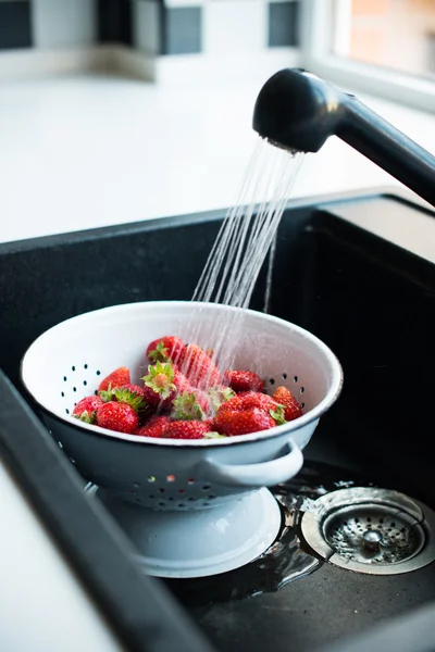 organic strawberries in colander