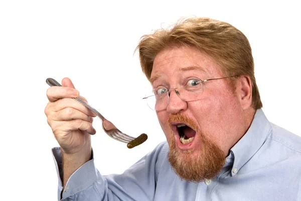 Man Eating Pickle On Fork — Stock Photo, Image