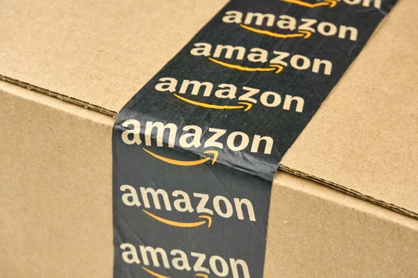 Amazon shipping box with branded tape. — Stock Photo, Image