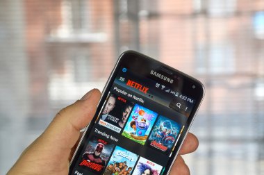 Netflix app on android cell phone clipart