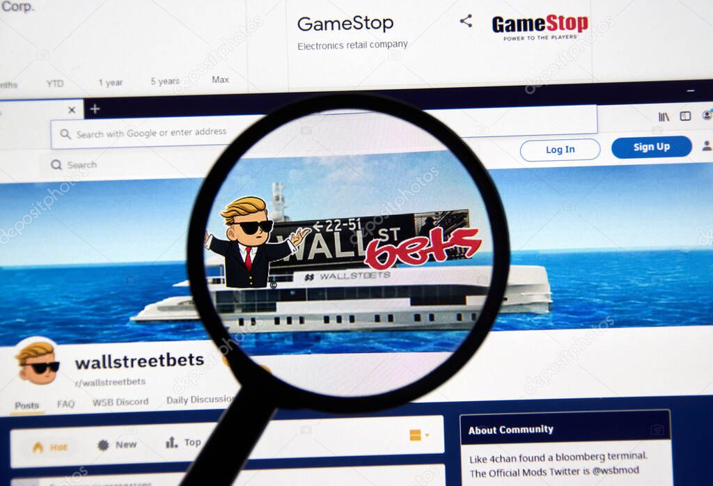 Montreal, Canada - February 3, 2021: Wallstreetbets Reddit group webpage and logo under magnifying glass. Wallstreetbets, also known as WSB, is a subreddit where participants discuss stock trading.