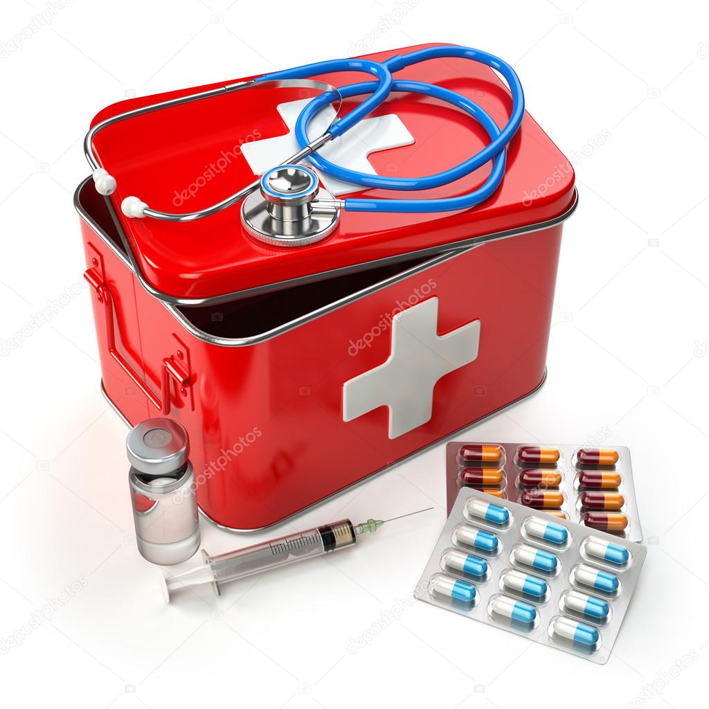 First aid kit with stethoscope, pills and syringe on the table.