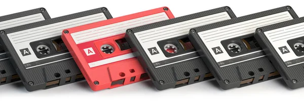 Vintage Zwarte Audiocassettes Een Unieke Roze Cassete Blauwe Achtergrond Creatief — Stockfoto