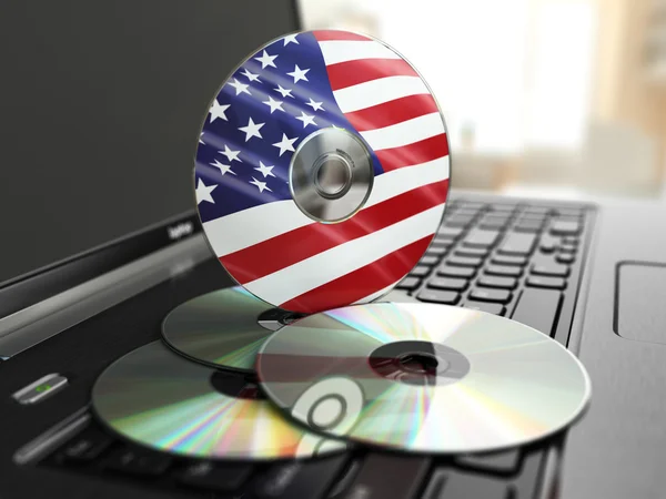 Oprogramowania w usa cd na klawiaturze laptopa. dyski kompaktowe. — Zdjęcie stockowe