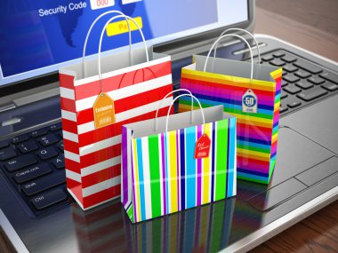 E-commerce concept. Colourful paper striped shopping bags on lap clipart