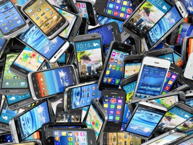 Mobile phones background. Pile of different modern smartphones.