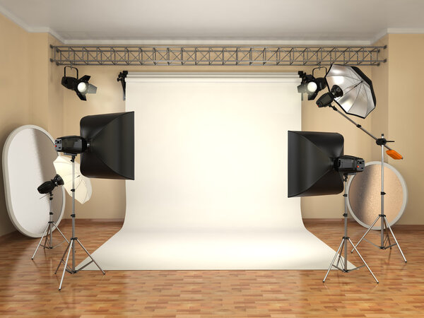 Photo studio with lighting equipment. Flashes, softboxes and ref