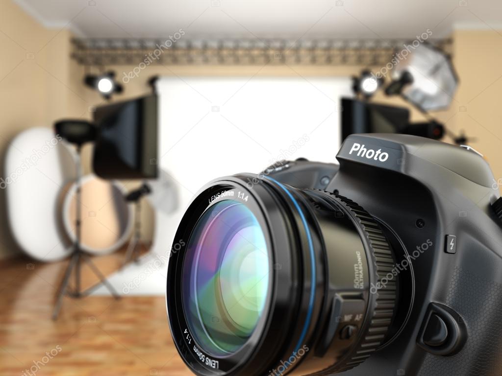 DSLR camera in photo studio with lighting equipment, softbox and