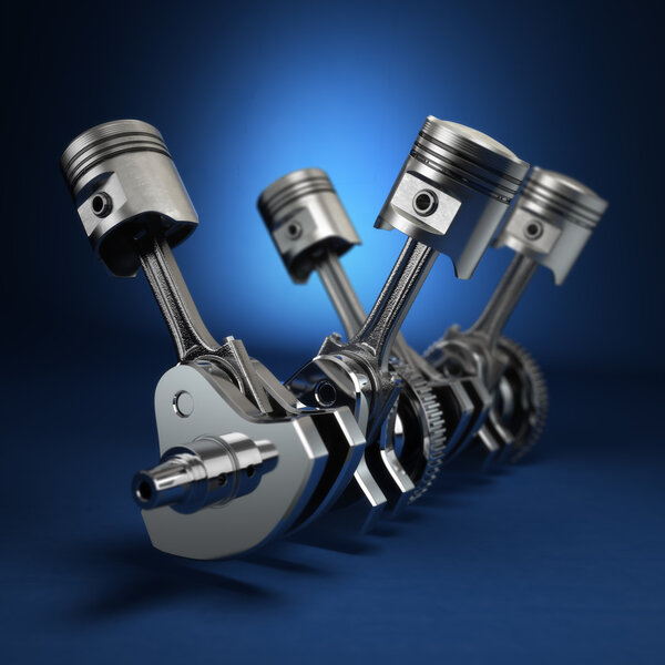 V4 engine pistons and cog on blue background.