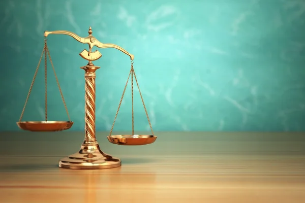 Concept of justice. Law scales on green background. — Stock Photo, Image