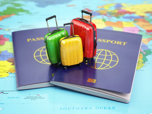 Travel or tourism concept. Passport and suitcases on the world m — Stock Photo, Image