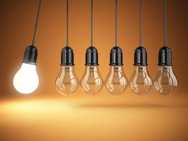 Idea o creativity concept. Light bulbs and perpetual motion. — Stock Photo, Image