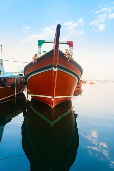 Big wooden cargo boat in blue water — Stock Photo, Image