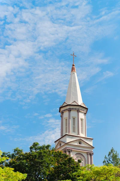 High tower turret of the church under blue sky — Stock Photo, Image