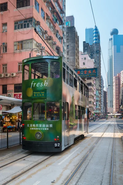 Electric trolleys and motor vehicles on a typical downtown stree — Stock Photo, Image