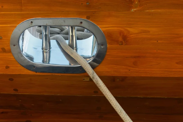 Stainless Steel Fairlead on a Wooden yacht — Stock Photo, Image