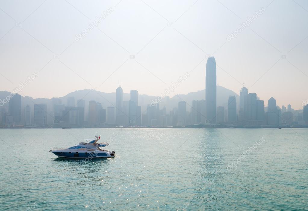 Lluxury speedboat with the city's famous skyline in the distant,