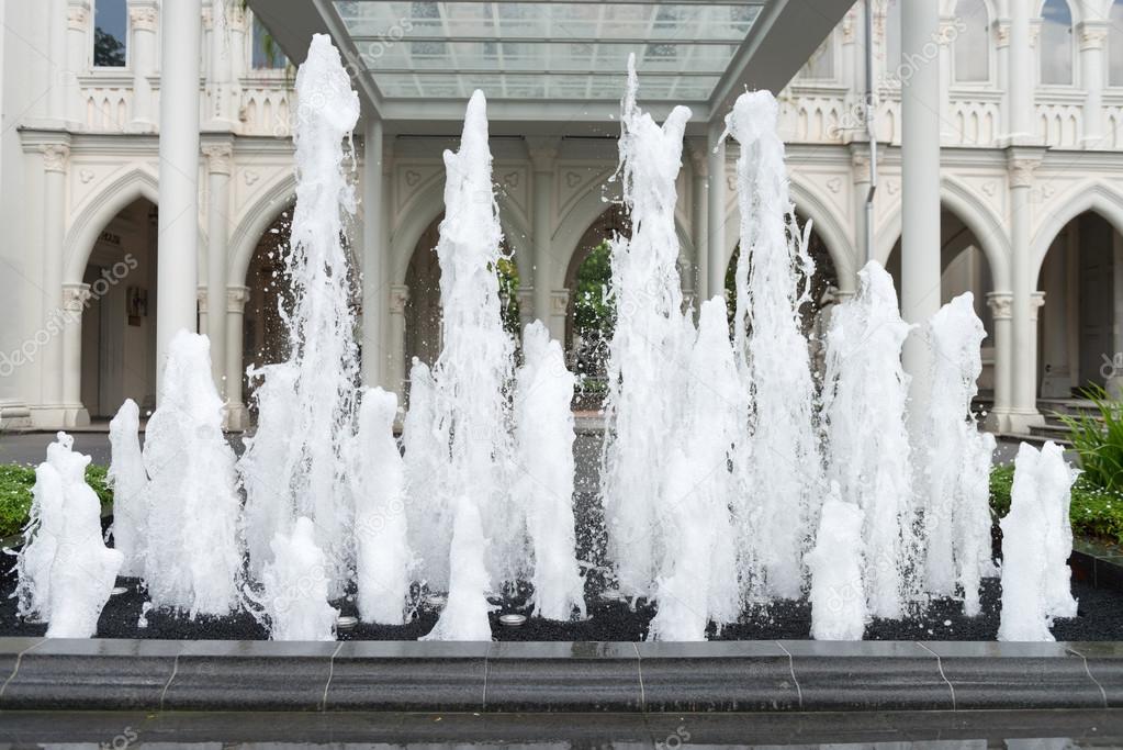 Numerous Vertical Jets of Water from an Ornate Fountain