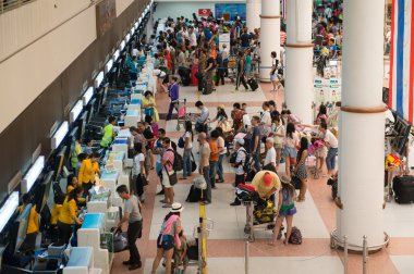 Passengers registering on check-in desks the international airpo