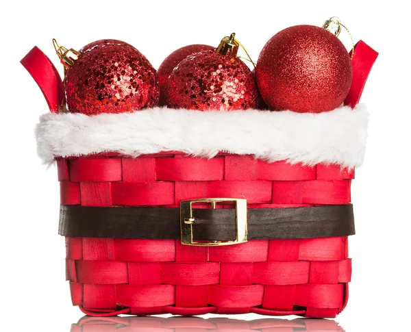 Christmas decorations on red basket — Stock Photo, Image