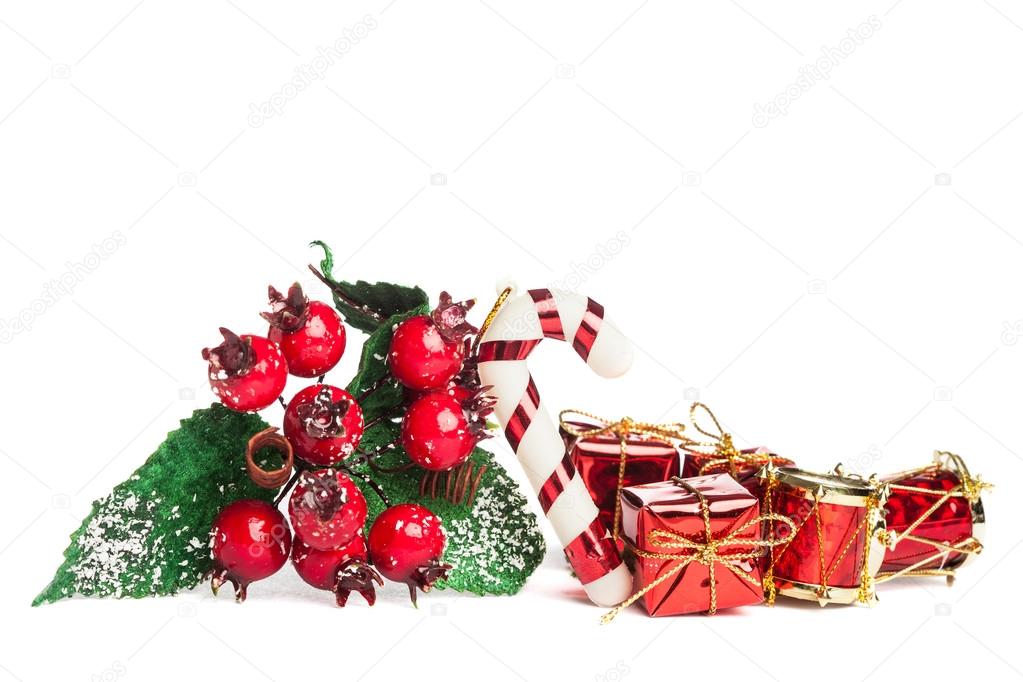 european holly with candy cane and gift box 