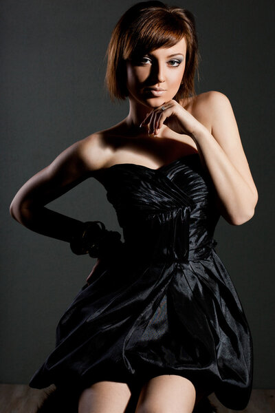 Elegant fashionable woman in black dress