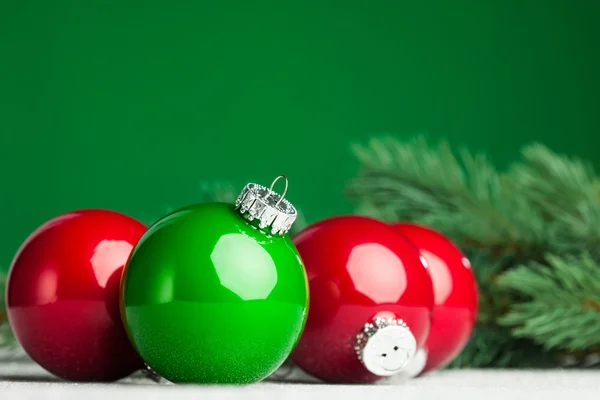 Christmas ball with green fir-tree — Stock Photo, Image