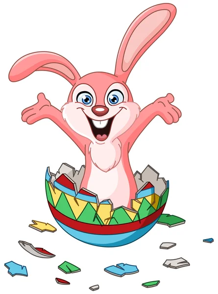 Conejo eclosionando de huevo de Pascua — Vector de stock