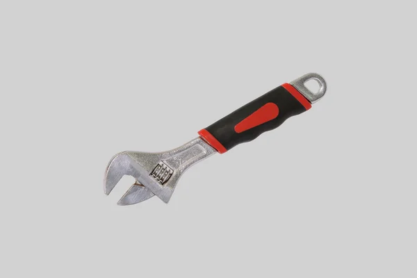 Adjustable wrench.  Isolated on a gray — Stock Photo, Image