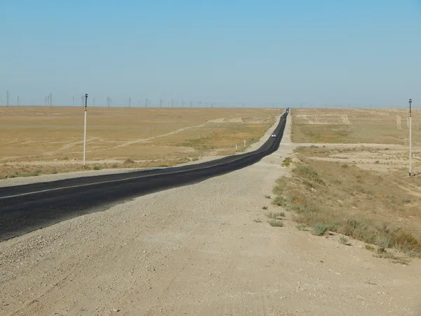 Silnice v poušti. — Stock fotografie
