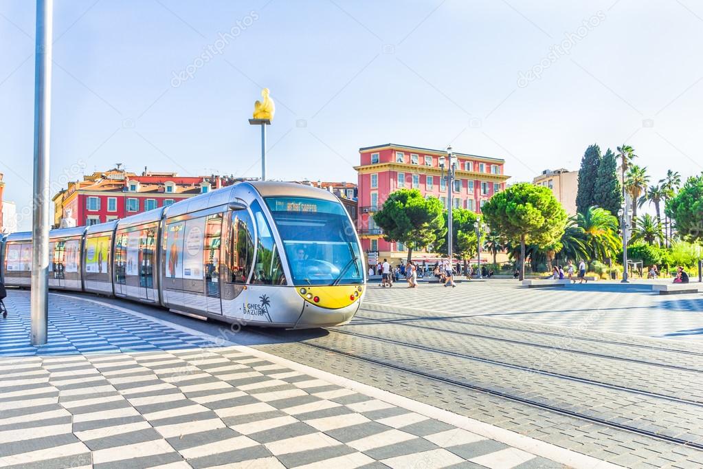 Tourists walking in the Place Massena, Nice, France